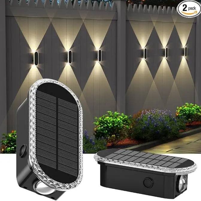 Solar wall light glowing warm white on outdoor wall at night — lifestyle shot