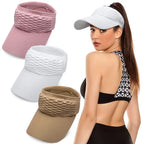 Three sun visor hats in pink, white, and khaki laid flat with model wearing white visor — color options display