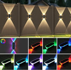 RGB solar fence lights illuminating white fence with 7 vibrant colors — solar powered, IP65, long lasting battery, easy installation