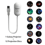 Galaxy projector projecting colorful nebula scene onto ceiling in dark bedroom