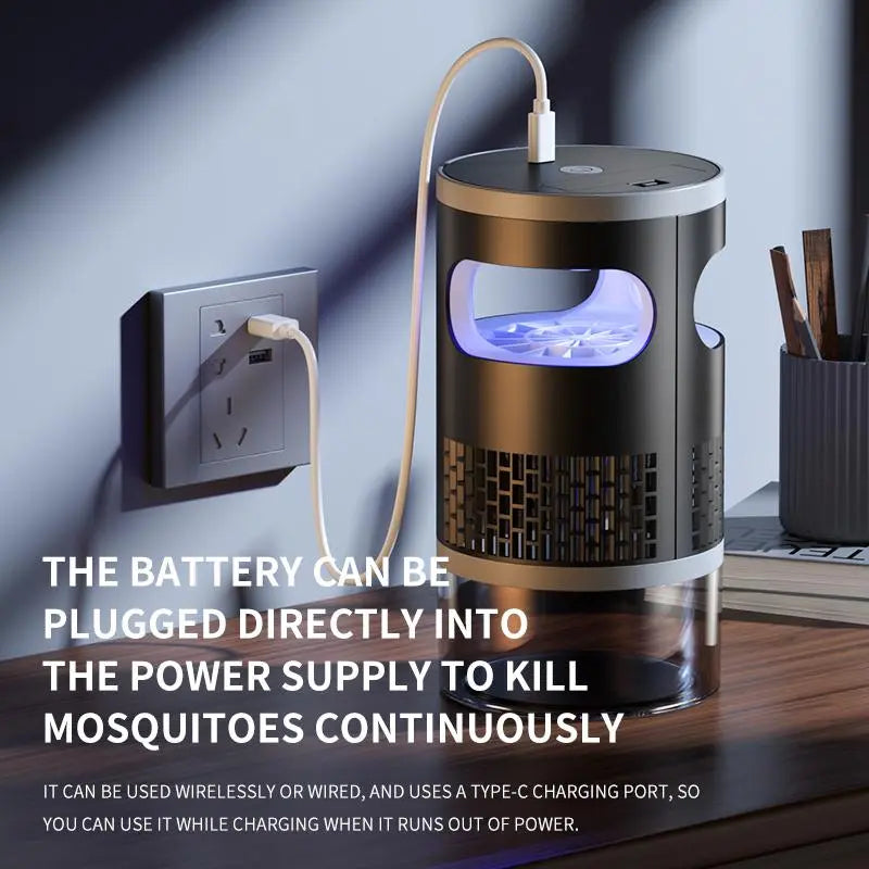 Outdoor camping mosquito killer lamp on wooden table at night